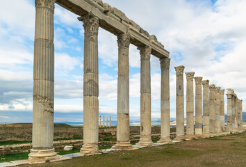 Columns in the ancient city of Hierapolis. A cloudy blue sky on the background of historical...