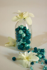 Glass bottle with turquoise pearl beads