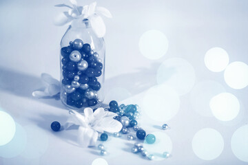 Glass bottle with blue pearl beads