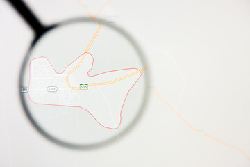 Marat city in Saudi Arabia visualization illustrative concept on display screen through magnifying glass