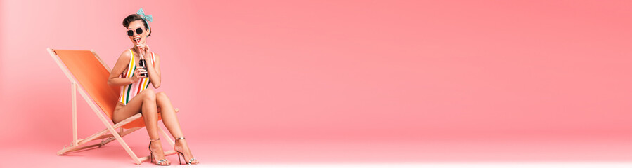 Portrait of a cheerful brunette pin-up girl in swimsuit