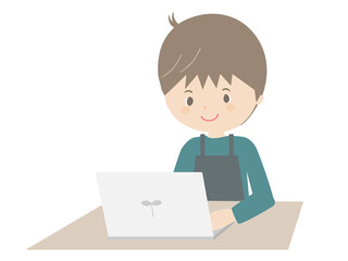 ノートパソコンを見るエプロンをつけた若い男性