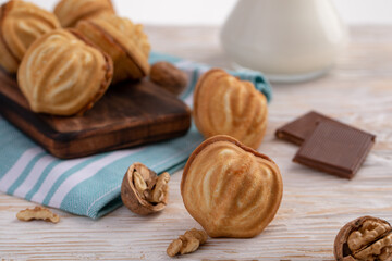 Obraz na płótnie Canvas nuts with condensed milk and ingredients - milk, nuts, chocolate.