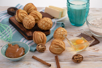 nuts with condensed milk and ingredients - milk, nuts, chocolate, egg, butter, flour, cinnamon, condensed milk.