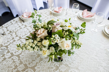 Top view of the presidium with floral arrangement with fresh white rose of the newlyweds at the wedding