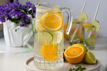 Water with fresh orange, lemon and lime slices.