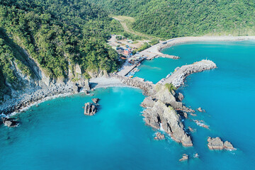 Fenniaolin Fish Harbor Aerial View - Blue seawater with morning bright sunlight, birds eye view use the drone, shot in Suao Township, Yilan, Taiwan.