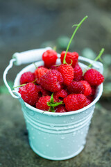 fresh raspberries in basket. Berries in garden. Organic healthy food. Fruits.