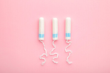 Menstrual tampons on a pink background. Cotton tampon for women