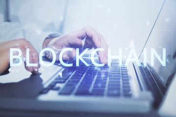 Blockchain theme hud with man working on computer on background. Concept of crypto chain. Double exposure.