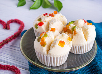 Thai steamed cupcakes topped with dry fruit on plate