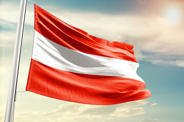 Austria national flag cloth fabric waving on the sky with beautiful sun light - Image