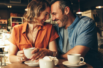 Loving couple of a date at coffee shop