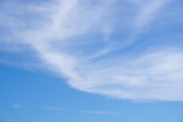 Big soft white clouds on clear blue sky