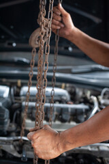 Hands of mechanic working in auto repair shop - 366483118
