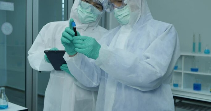 Two Scientists Working On Coronavirus Vaccine At Lab. 