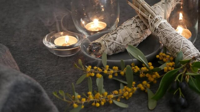 Dried white sage smudge stick, relaxation and aromatherapy. Smudging during psychic occult ceremony, herbal healing, yoga or aura cleaning. Essential incense for esoteric rituals and fortune telling.