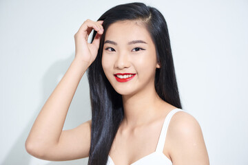 Fototapeta premium Young beautiful Asian woman with smiley face isolated on white background.
