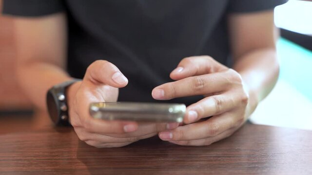 Clopped female use smartphone in the house