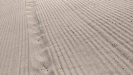 Sand on the beach after being smoothed out