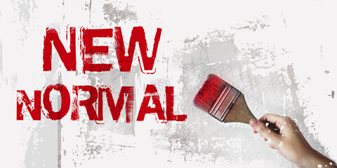 New normal words in red, brush in hand. concept effected by COVID 19 lifestyle