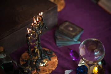 Fototapeta na wymiar Old world, Magic attributes for rituals and fate prediction, details on a table of witch, occultism concept