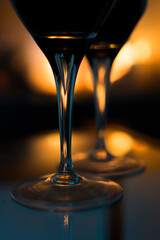 Glass of wine in front of a hot fireplace.