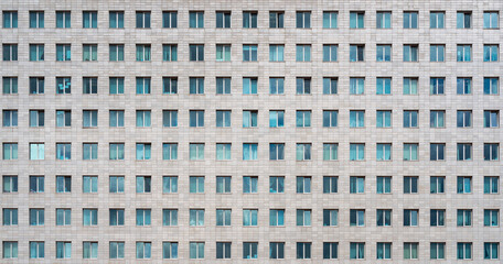 Modern office building. Windows of a multi-storey skyscraper. Rows of identical windows.