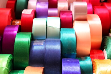 Close up view of colorful ribbon bobbins