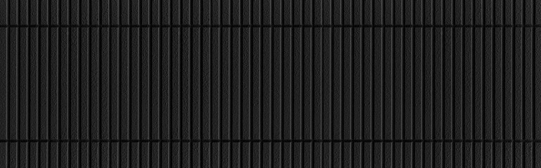 Panorama of Modern black stone wall with stripes texture and seamless background