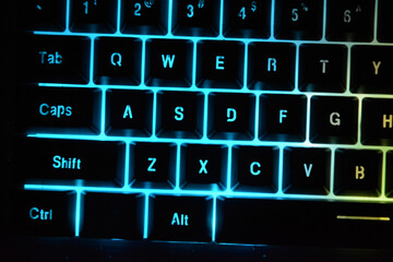 Computer keyboard with coloured letter keys