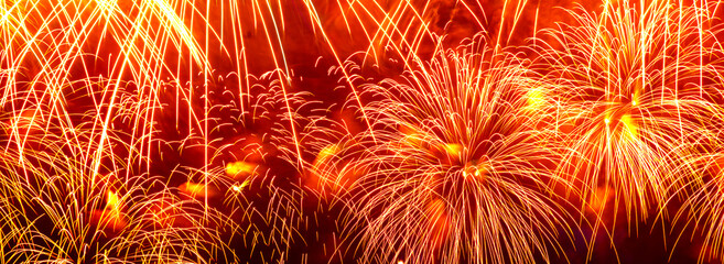 Wide festive background with red fireworks