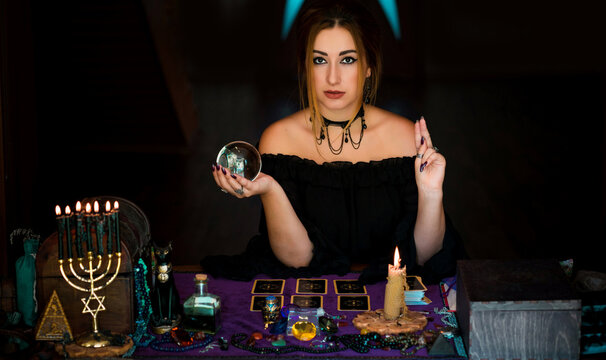  Woman fortune teller on a crystal ball, Concept of predictions, magic rituals and wicca