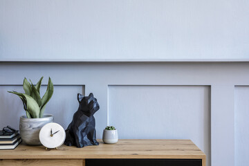 Stylish scandinavian composition with wooden commode, candle, succulent in pot, books, white clock,...
