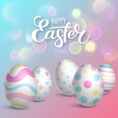 Realistic decorated eggs on bokeh background. Easter greeting card or invitation template