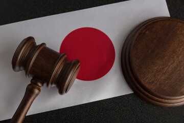 Lawyers wooden gavel against background of flag of Japan. Law and justice. Legality concept