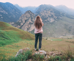 Naklejka premium Two Couples of Mountain Hikers on the foggy peak