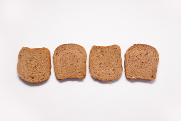 Assortment of baked bread on white background