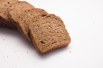 Assortment of baked bread on white background