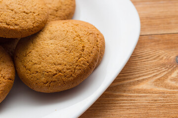 Homemade oatmeal cookie on the wooden background