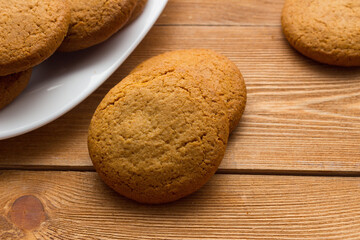 Homemade oatmeal cookie on the wooden background