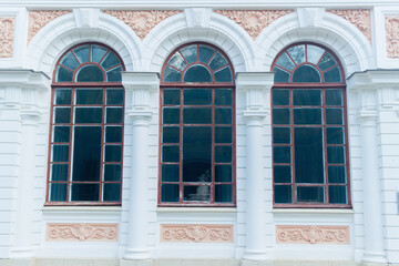Fototapeta na wymiar Beautiful traditional window with wooden shutters
