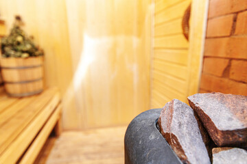 Interior details Finnish sauna steam room with traditional sauna accessories basin birch broom. Traditional old Russian bathhouse SPA Concept. Relax country village bath concept.