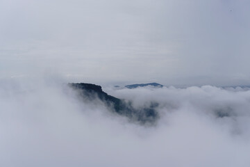 Mountain and cliff edge in the fog of Pha Mo E Dang cliff, Thailand
