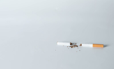 teared cigarette on white background concept for no smoking or quit smoking.