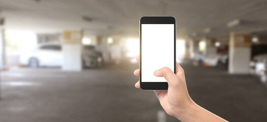 Hand holding smartphone device and touching screen