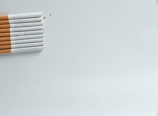 stack of cigarettes isolated on white background with copy space