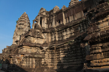 The temple complex of Angkor Watt, Cambodia, early morning sun looking at towers