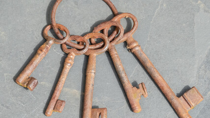 rusty keys on grey slate