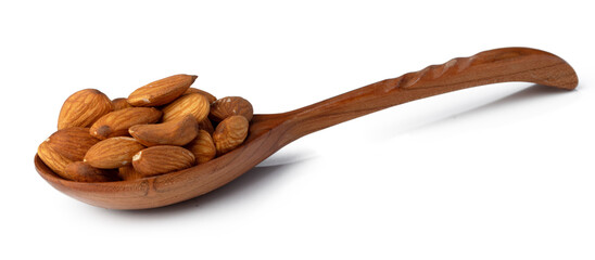 Wooden spoon with roasted almonds isolated on white